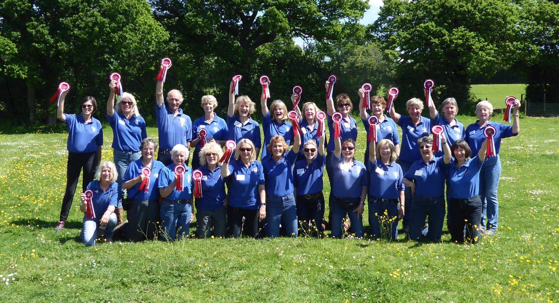 Court Meadow RDA volunteers holding rosettes
