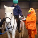 Rider receiving Easter egg from Easter Chick